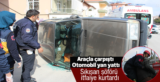 Sürücüyü yan yatan otomobilden itfaiye çıkardı