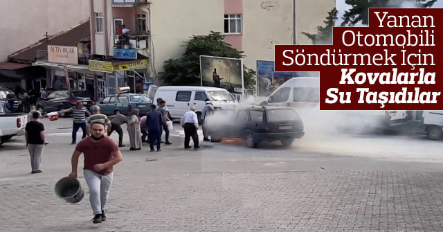 Yanan Otomobili Söndürmek İçin Kovalarla Su Taşıdılar